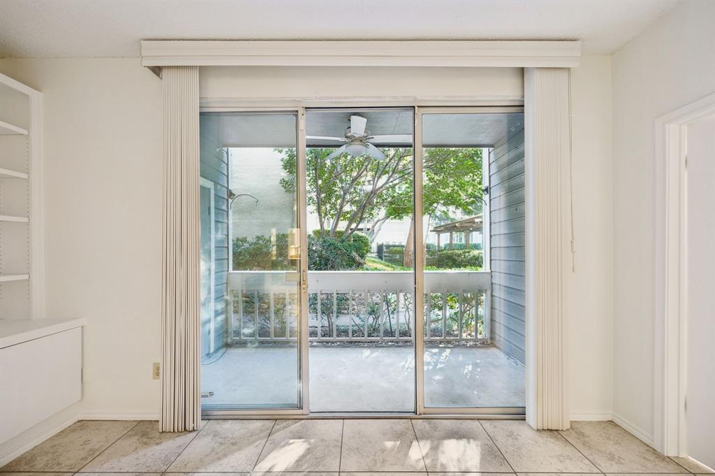5310 Keller Springs Road, Unit 612 Dallas, TX 75248 - Photo 14 of 33 Sliding patio doors from the living room to the patio.
