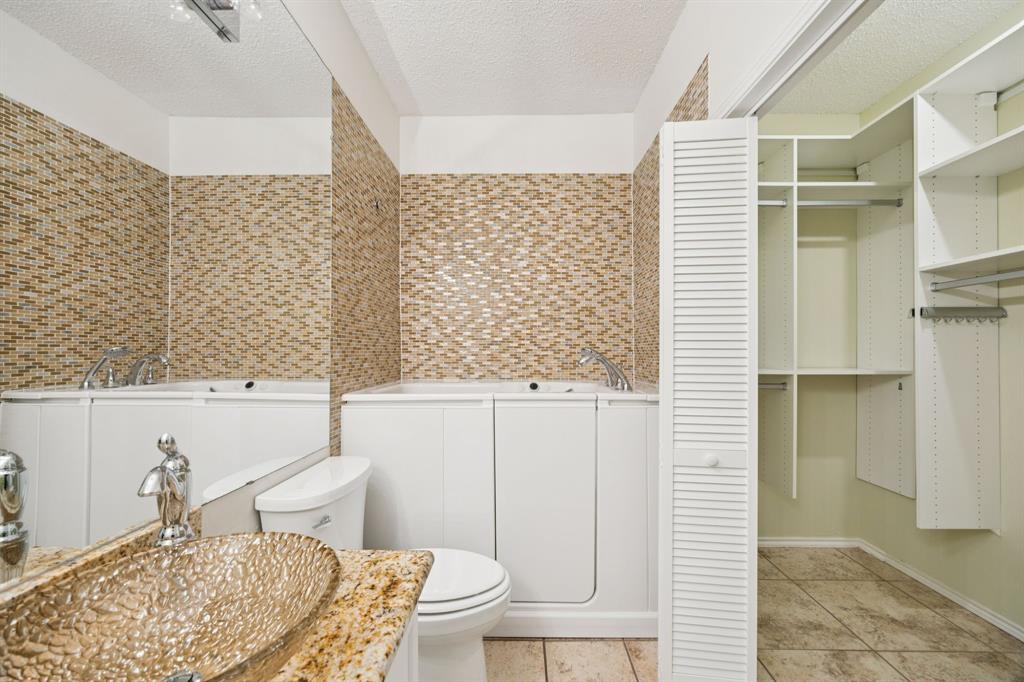 5310 Keller Springs Road, Unit 612 Dallas, TX 75248 - Photo 17 of 33 Kohler walk-in tub with hydro jets.
