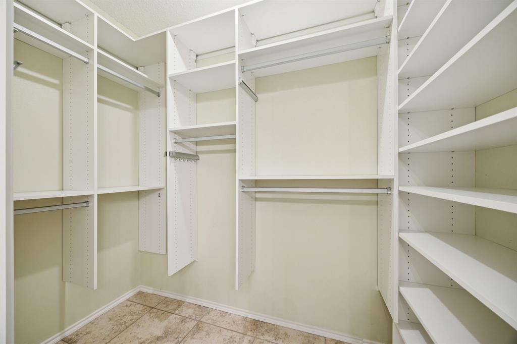5310 Keller Springs Road, Unit 612 Dallas, TX 75248 - Photo 18 of 33 Spacious walk-in closet in the primary bathroom.