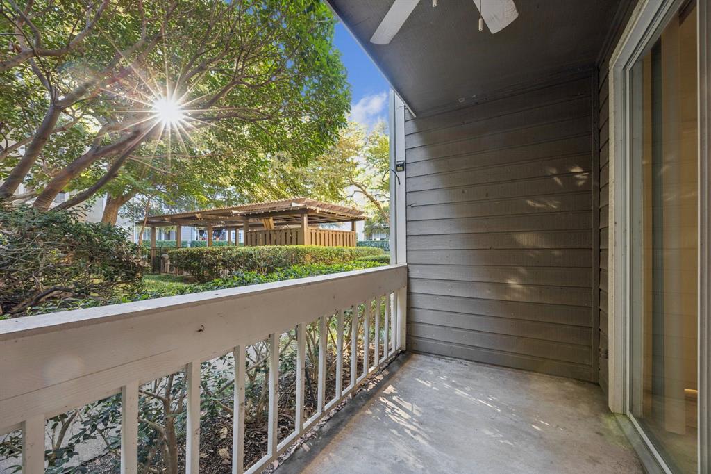5310 Keller Springs Road, Unit 612 Dallas, TX 75248 - Photo 25 of 33 Covered patio overlooking mature landscaping featuring ceiling fan