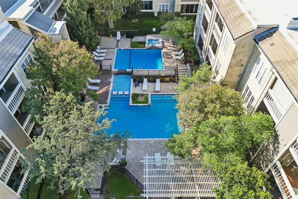 5310 Keller Springs Road, Unit 612 Dallas, TX 75248 - Photo 4 of 33 Drone / aerial view of a pool area