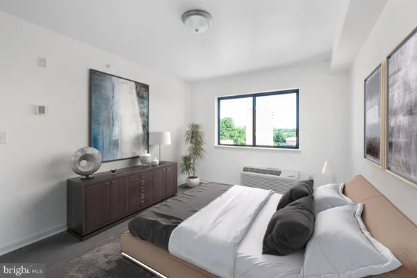 a bedroom with a bed and window