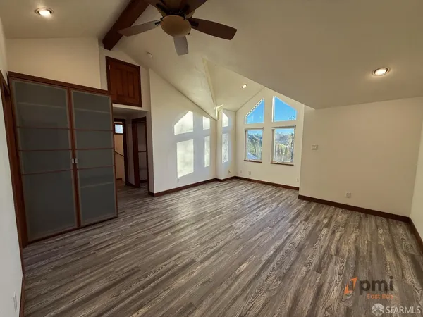a bathroom with a granite countertop sink a large mirror and a bathtub