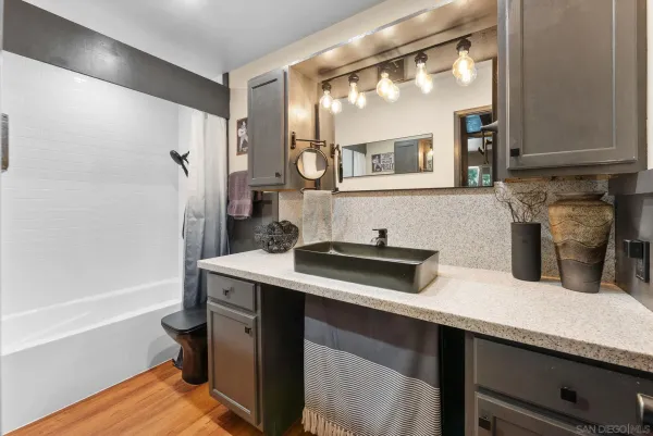 a kitchen with a sink and a refrigerator