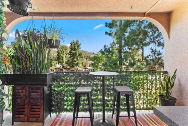 a view of a chairs and table in the patio
