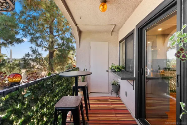 a balcony view with a seating space
