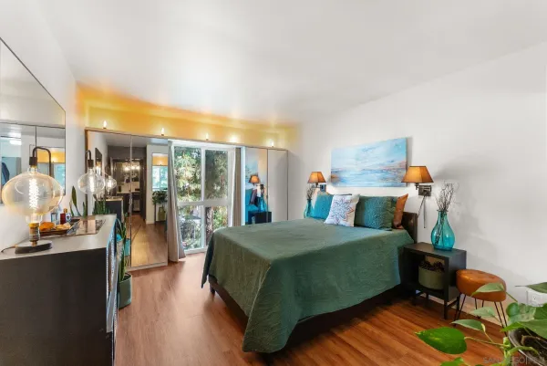 a bedroom with a bed and large closet