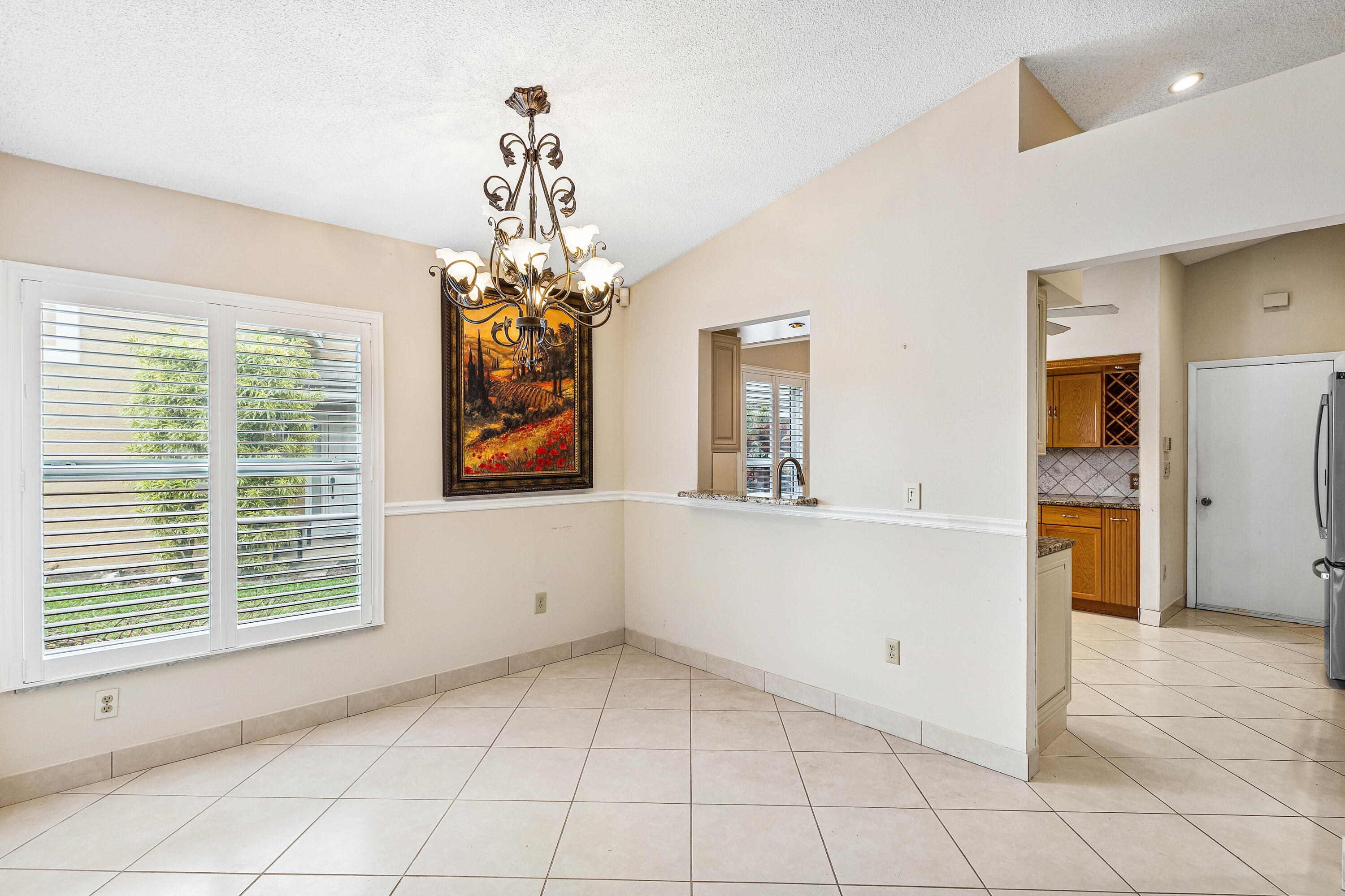 6249 Beaconwood Road Lake Worth, FL 33467 - Photo 12 of 46 a view of an empty room with window and cabinet