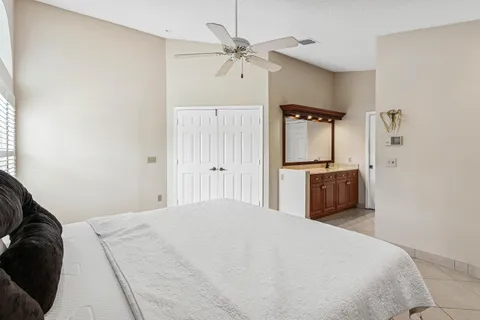 a large bed in a white room