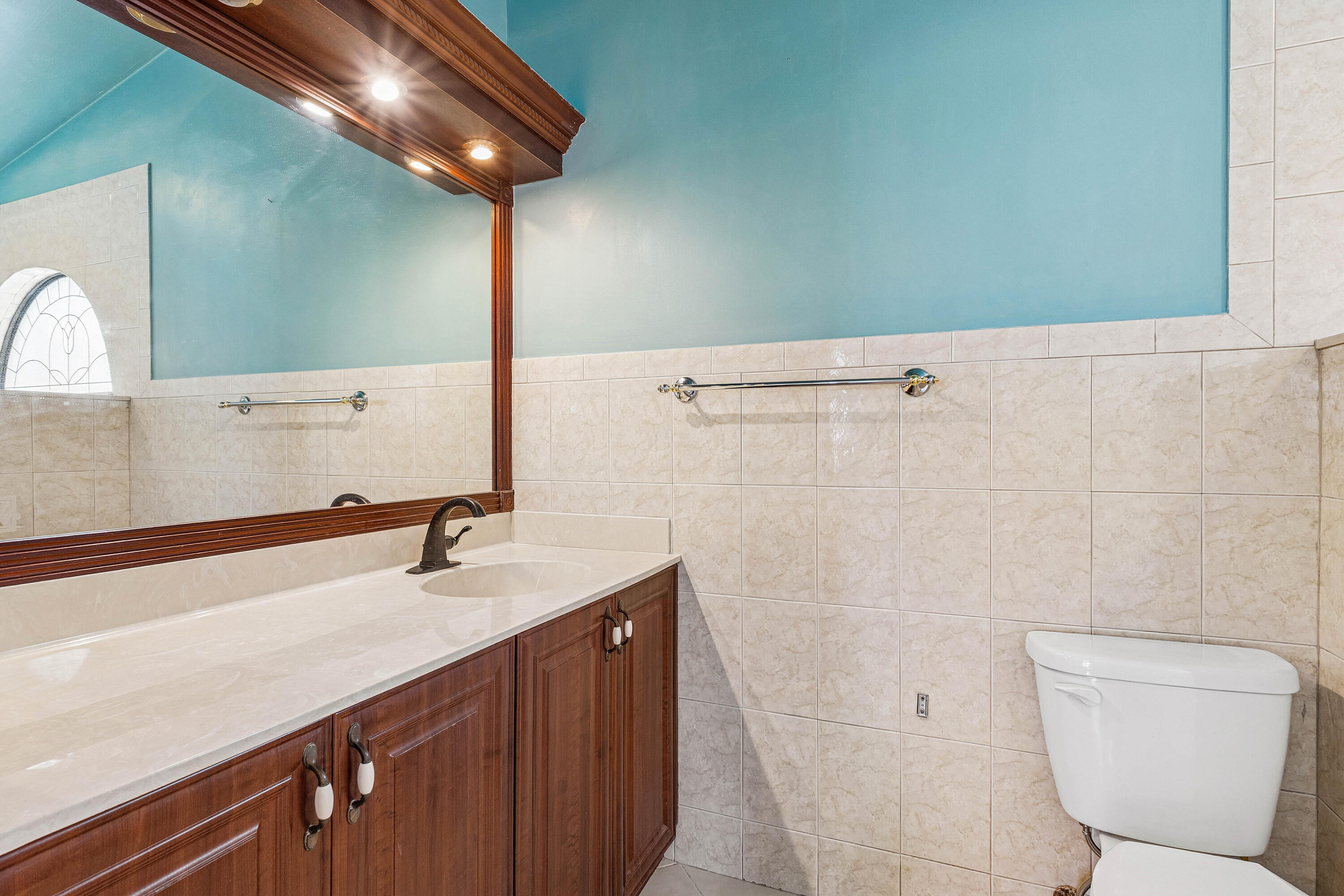 6249 Beaconwood Road Lake Worth, FL 33467 - Photo 23 of 46 a bathroom with a sink a toilet and shower