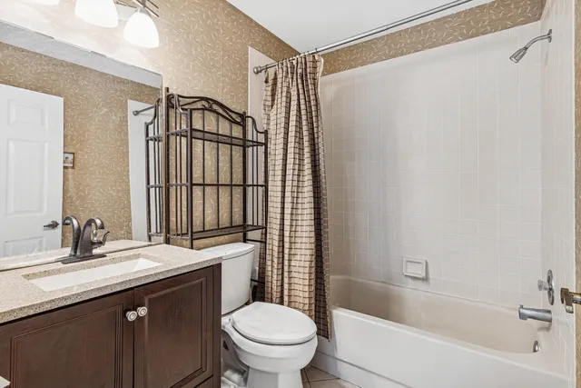 a bathroom with a sink a toilet and a bathtub