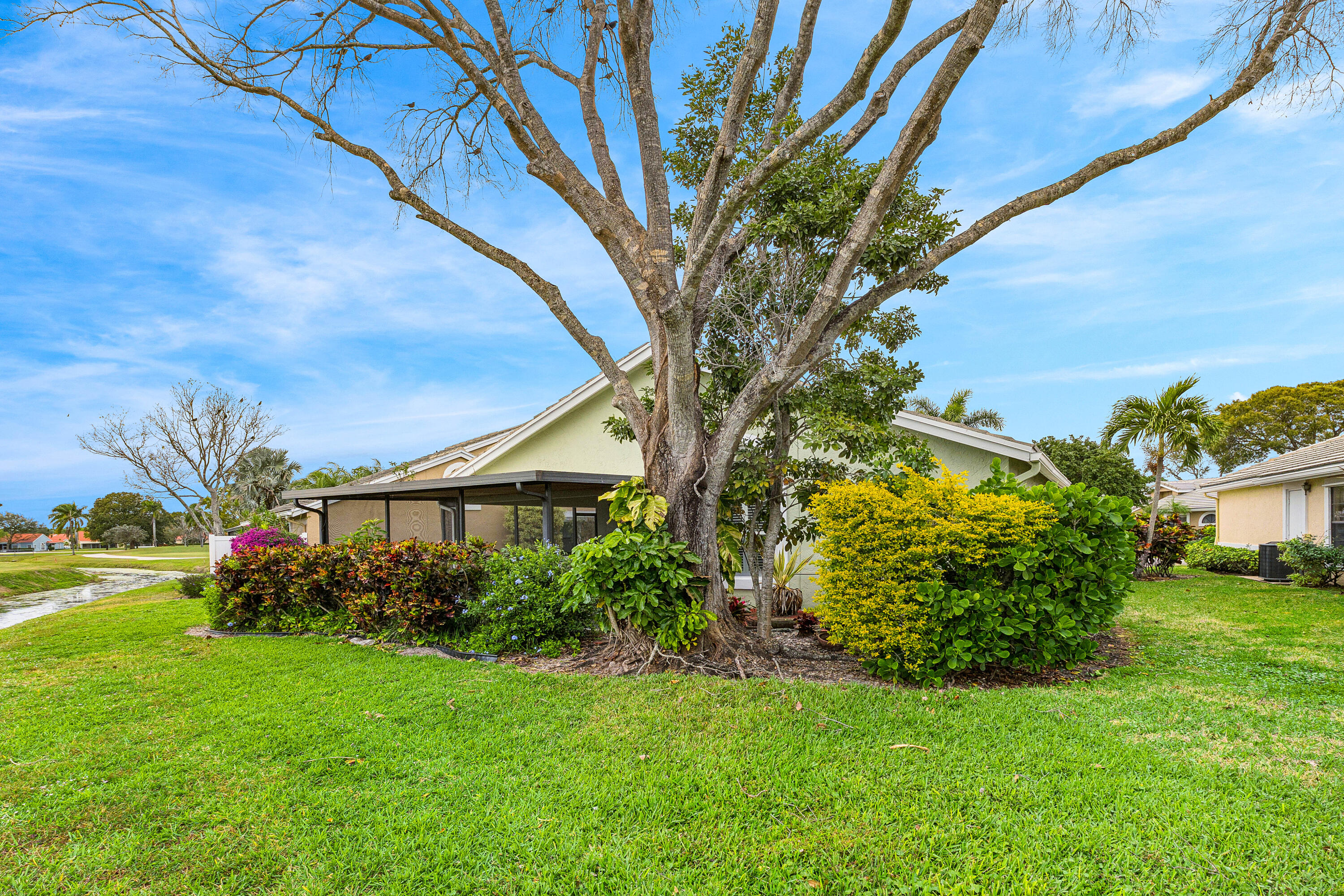6249 Beaconwood Road Lake Worth, FL 33467 - Photo 32 of 46 a view of a garden with a house