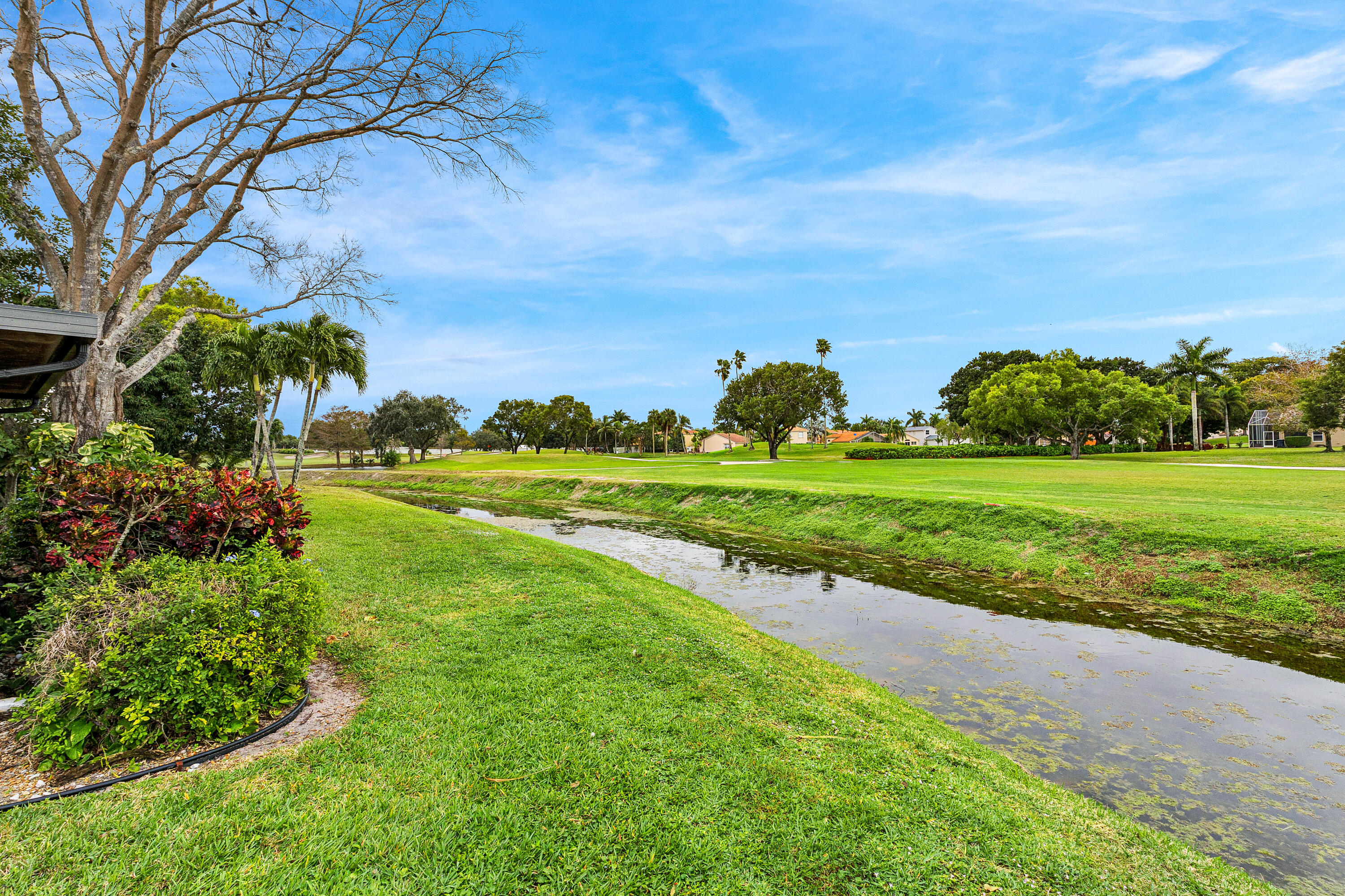 6249 Beaconwood Road Lake Worth, FL 33467 - Photo 33 of 46 a view of a golf course with a garden