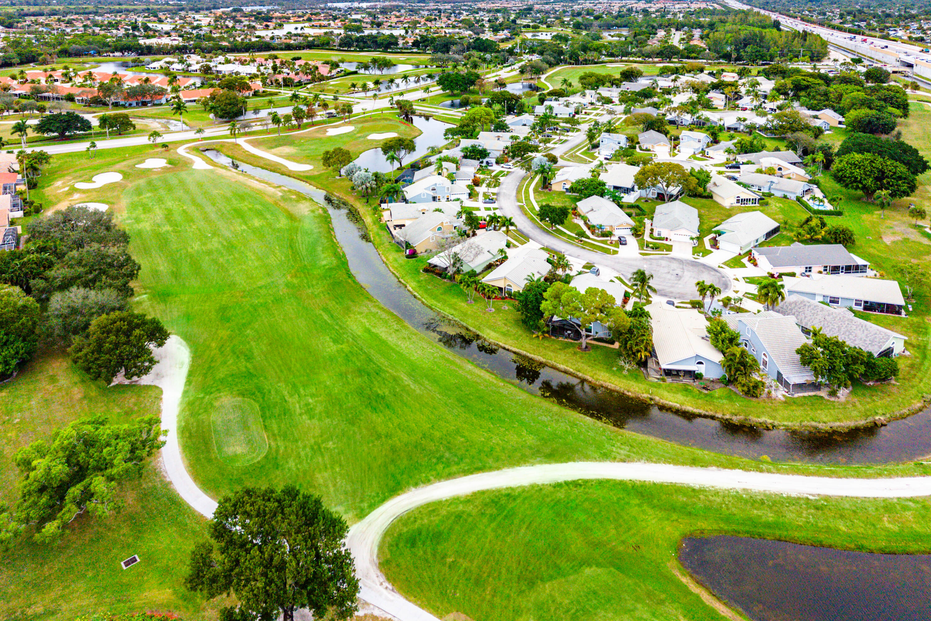 6249 Beaconwood Road Lake Worth, FL 33467 - Photo 37 of 46 an aerial view of a residential houses with yard