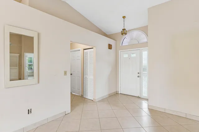 a view of a hallway with closet and entryway