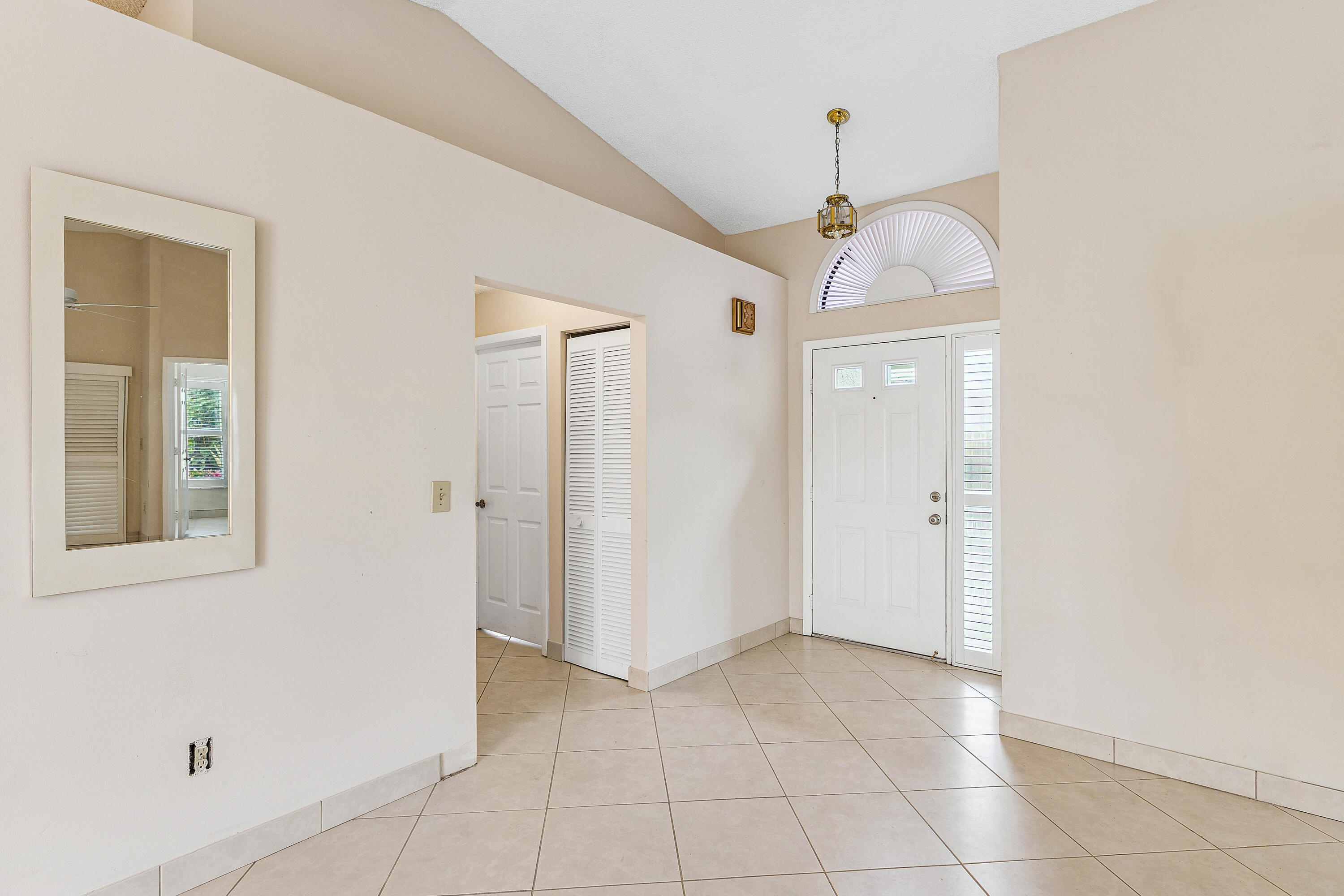6249 Beaconwood Road Lake Worth, FL 33467 - Photo 7 of 46 a view of a hallway with closet and entryway
