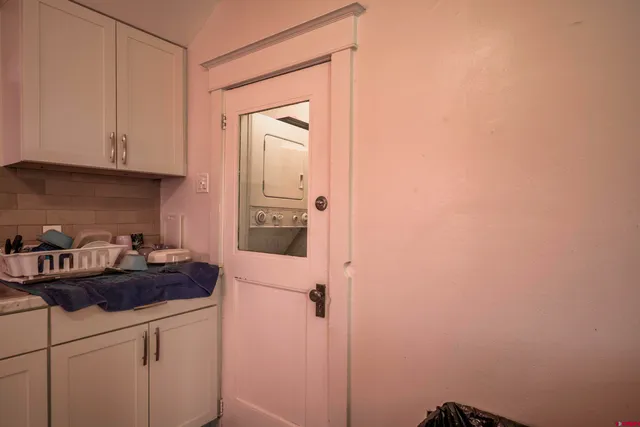a kitchen with a refrigerator and cabinets
