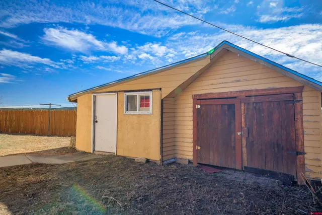 a view of a house with a street