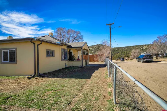 a view of a back yard of the house