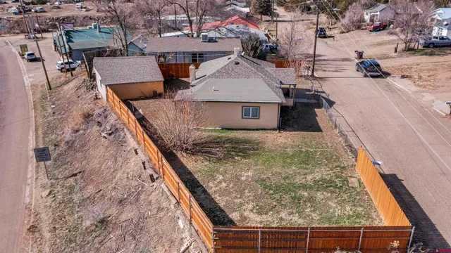 a front view of a house with sitting area