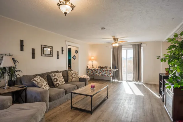 a living room with furniture and a large window