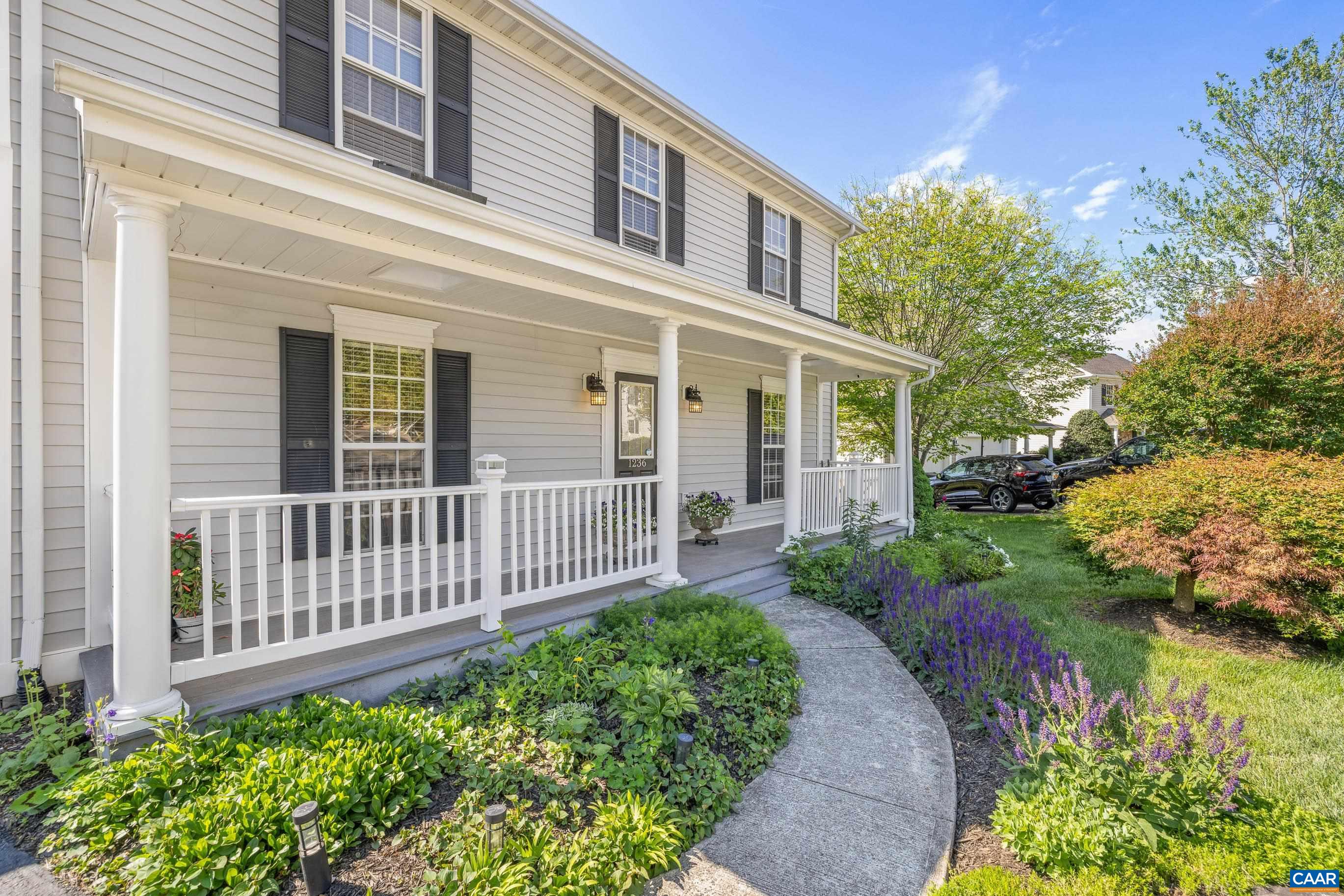 1236 Amber Ridge Road Charlottesville, VA 22901 - Photo 4 of 56 a front view of a house with a yard