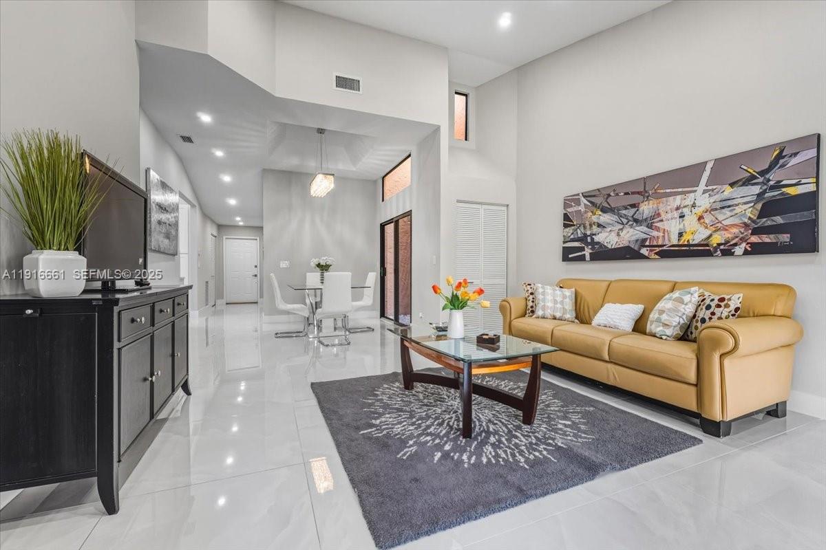 22708 Meridiana Drive Boca Raton, FL 33433 - Photo 12 of 46 a living room with furniture and wooden floor