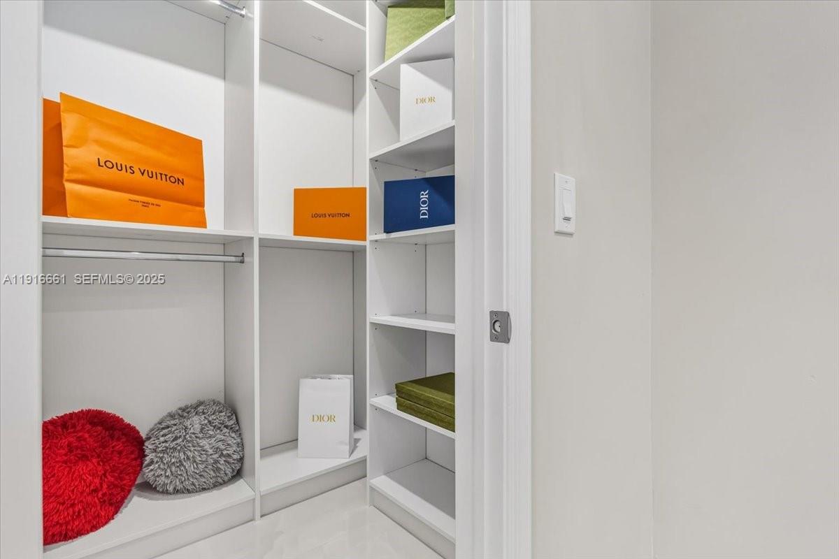 22708 Meridiana Drive Boca Raton, FL 33433 - Photo 32 of 46 a bedroom with a bed and a window