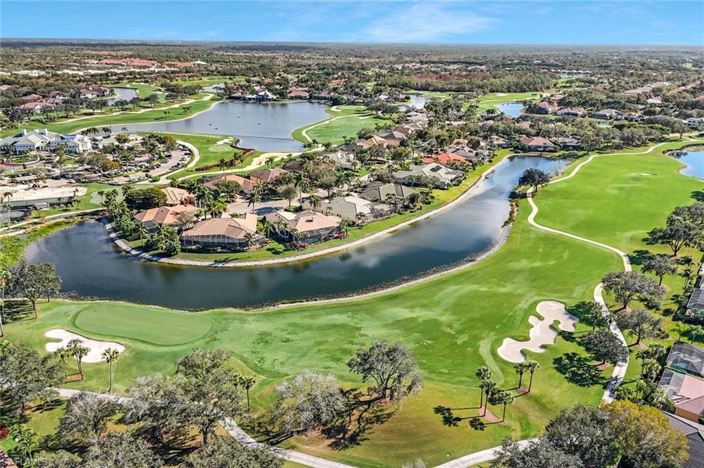 5025 Blauvelt Way, Unit 202 Naples, FL 34105 - Photo 21 of 26 an aerial view of a house with a garden