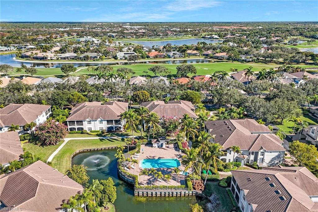 5025 Blauvelt Way, Unit 202 Naples, FL 34105 - Photo 23 of 26 an aerial view of residential houses with outdoor space and swimming pool