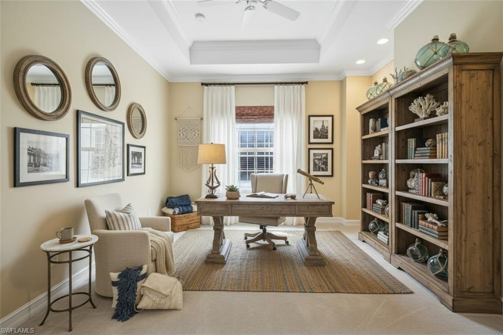 5025 Blauvelt Way, Unit 202 Naples, FL 34105 - Photo 9 of 26 a living room with furniture and a book shelf