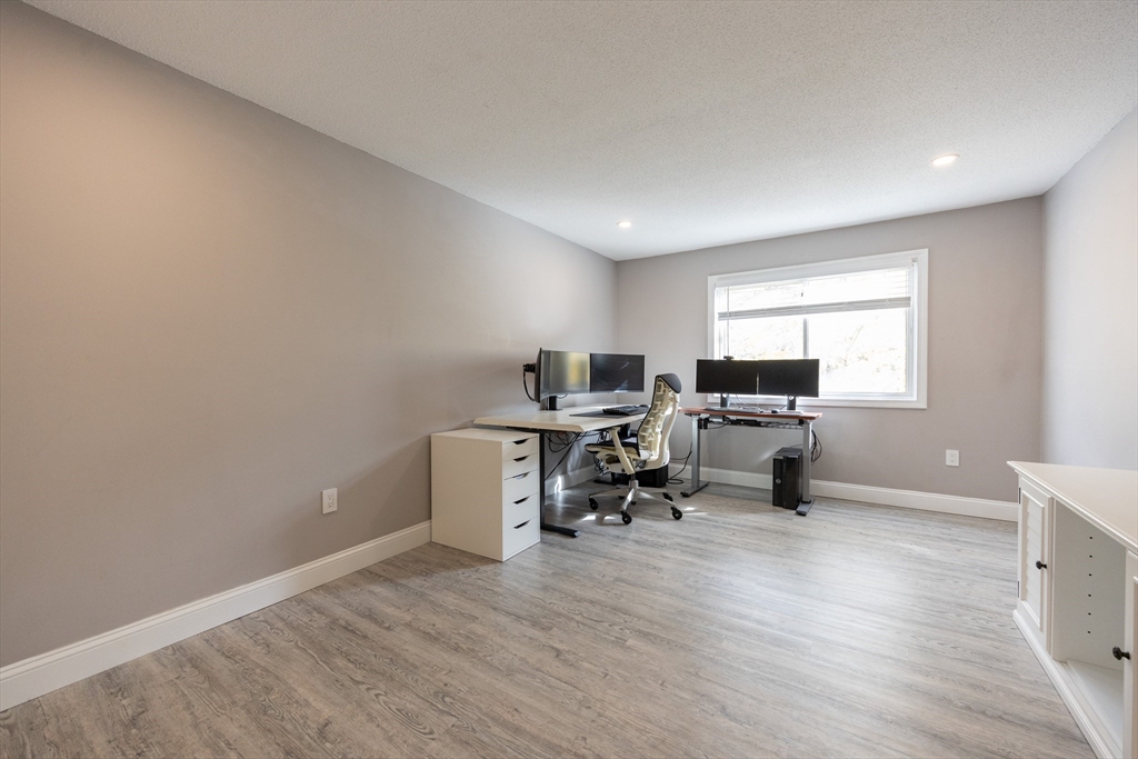 605 Franklin Crossing Road, Unit 605 Franklin, MA 02038 - Photo 16 of 31 a view of a workspace with furniture and a window