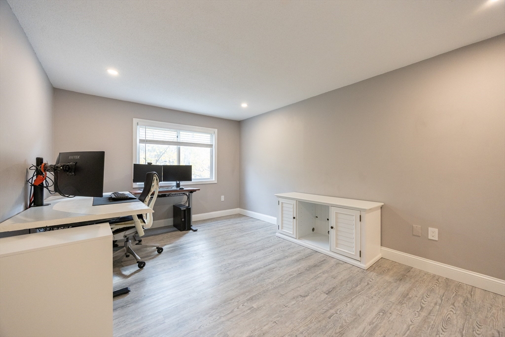 605 Franklin Crossing Road, Unit 605 Franklin, MA 02038 - Photo 17 of 31 a view of workspace with wooden floor and windows