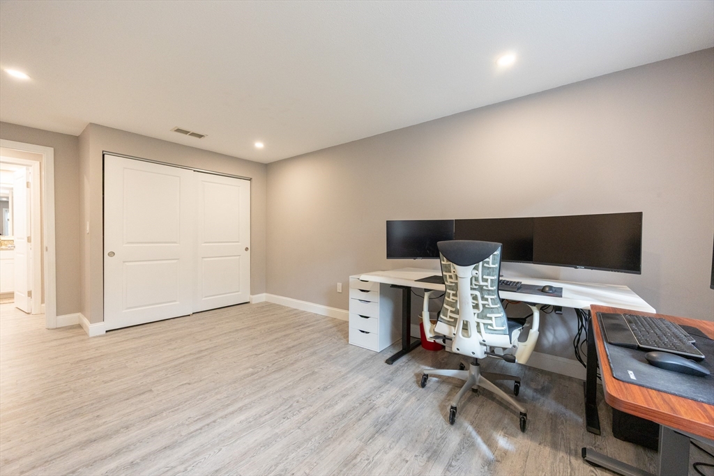 605 Franklin Crossing Road, Unit 605 Franklin, MA 02038 - Photo 18 of 31 a view of a workspace with furniture and a window