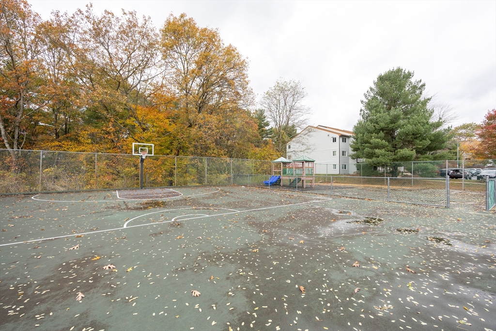 605 Franklin Crossing Road, Unit 605 Franklin, MA 02038 - Photo 27 of 31 a view of road with large trees