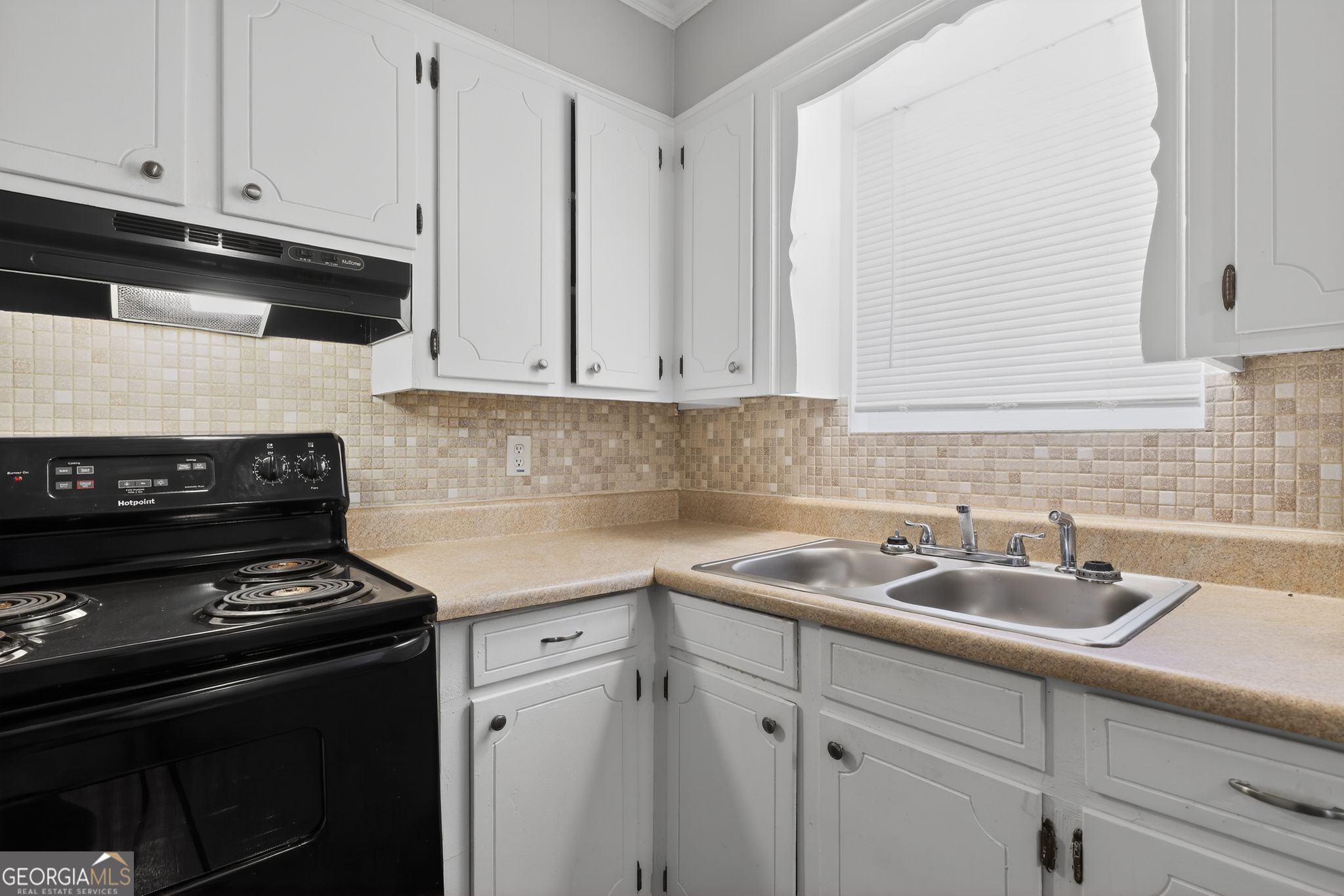 2508 Dexter Road Augusta, GA 30906 - Photo 19 of 33 a kitchen with a sink stove and cabinets