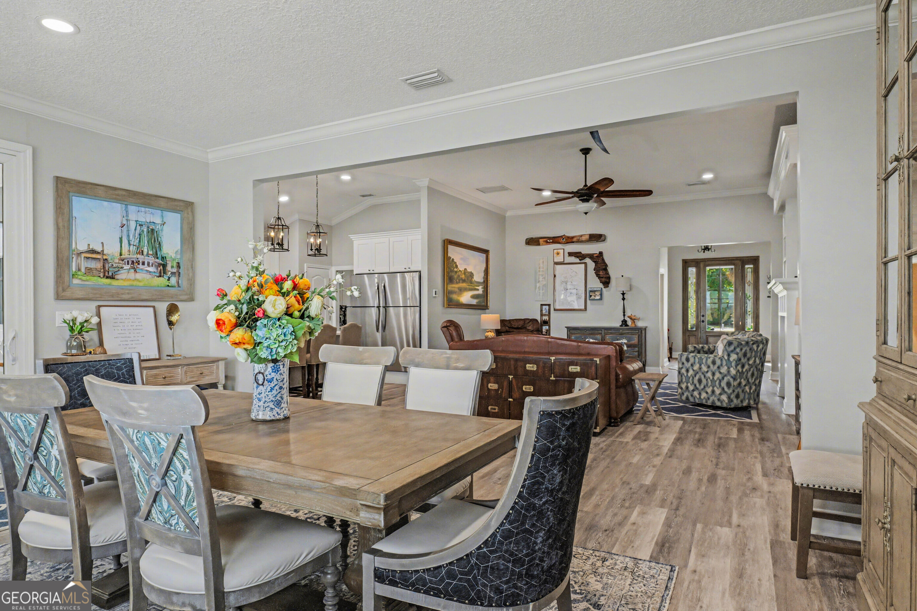 97222 Pirates Point Road Yulee, FL 32097 - Photo 20 of 82 a view of a dining room with furniture and wooden floor