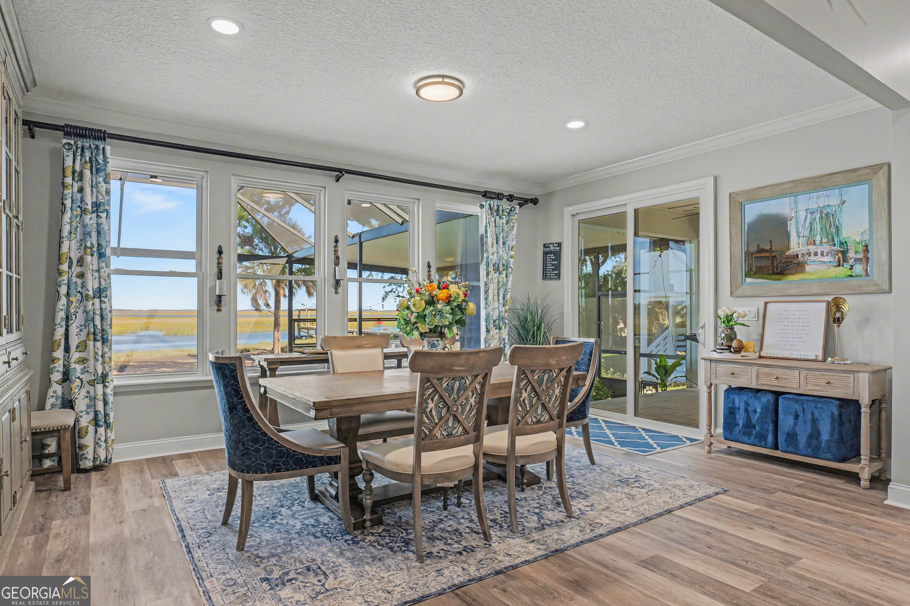 97222 Pirates Point Road Yulee, FL 32097 - Photo 21 of 82 a view of a dining room with furniture window and wooden floor