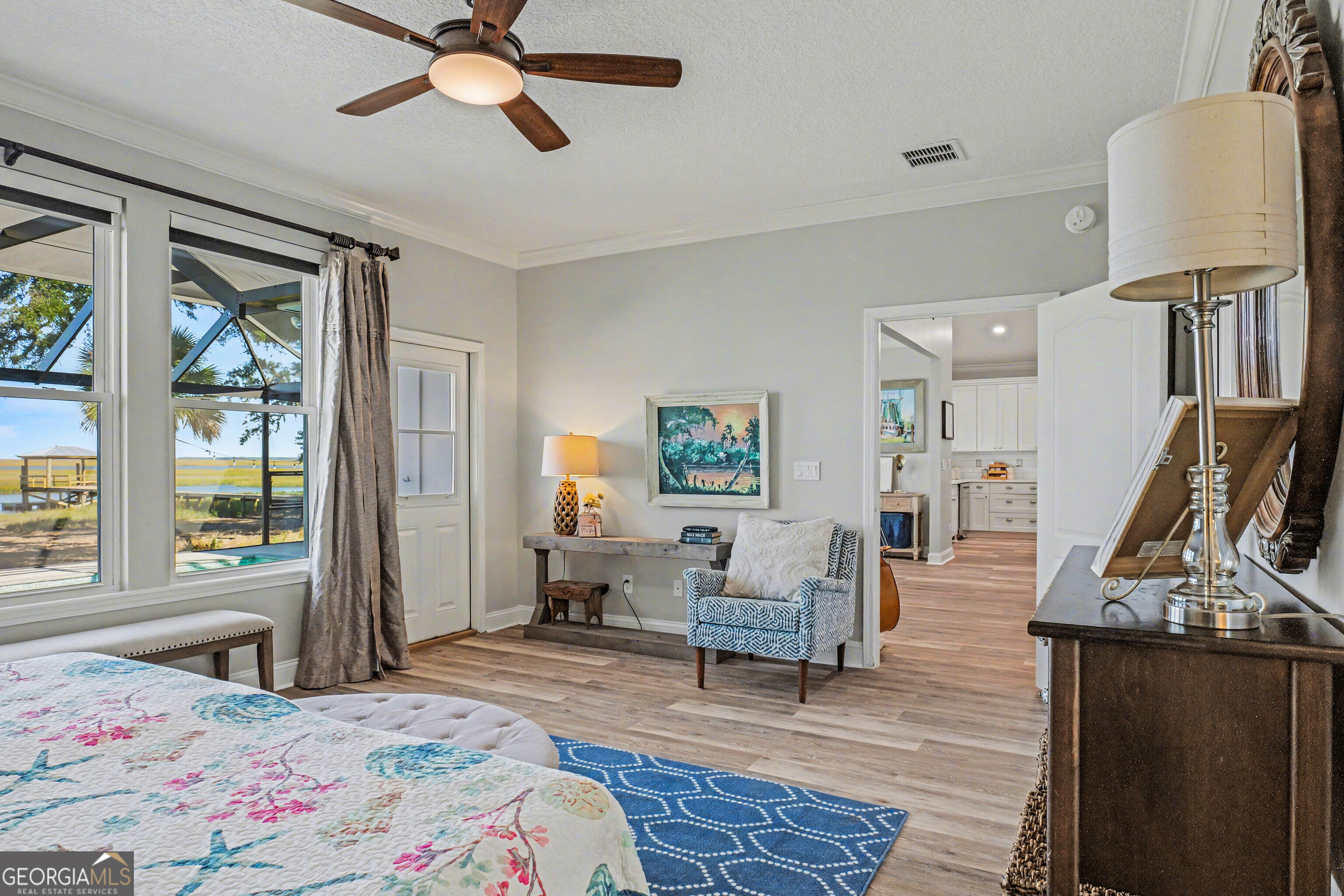 97222 Pirates Point Road Yulee, FL 32097 - Photo 27 of 82 a bedroom with a bed and wooden floor