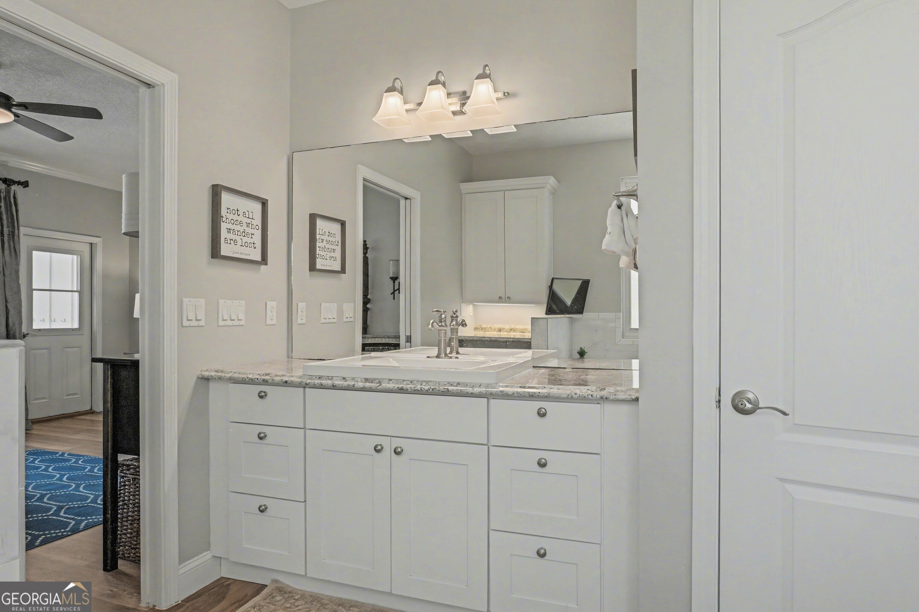 97222 Pirates Point Road Yulee, FL 32097 - Photo 32 of 82 a bathroom with a double vanity sink and a mirror