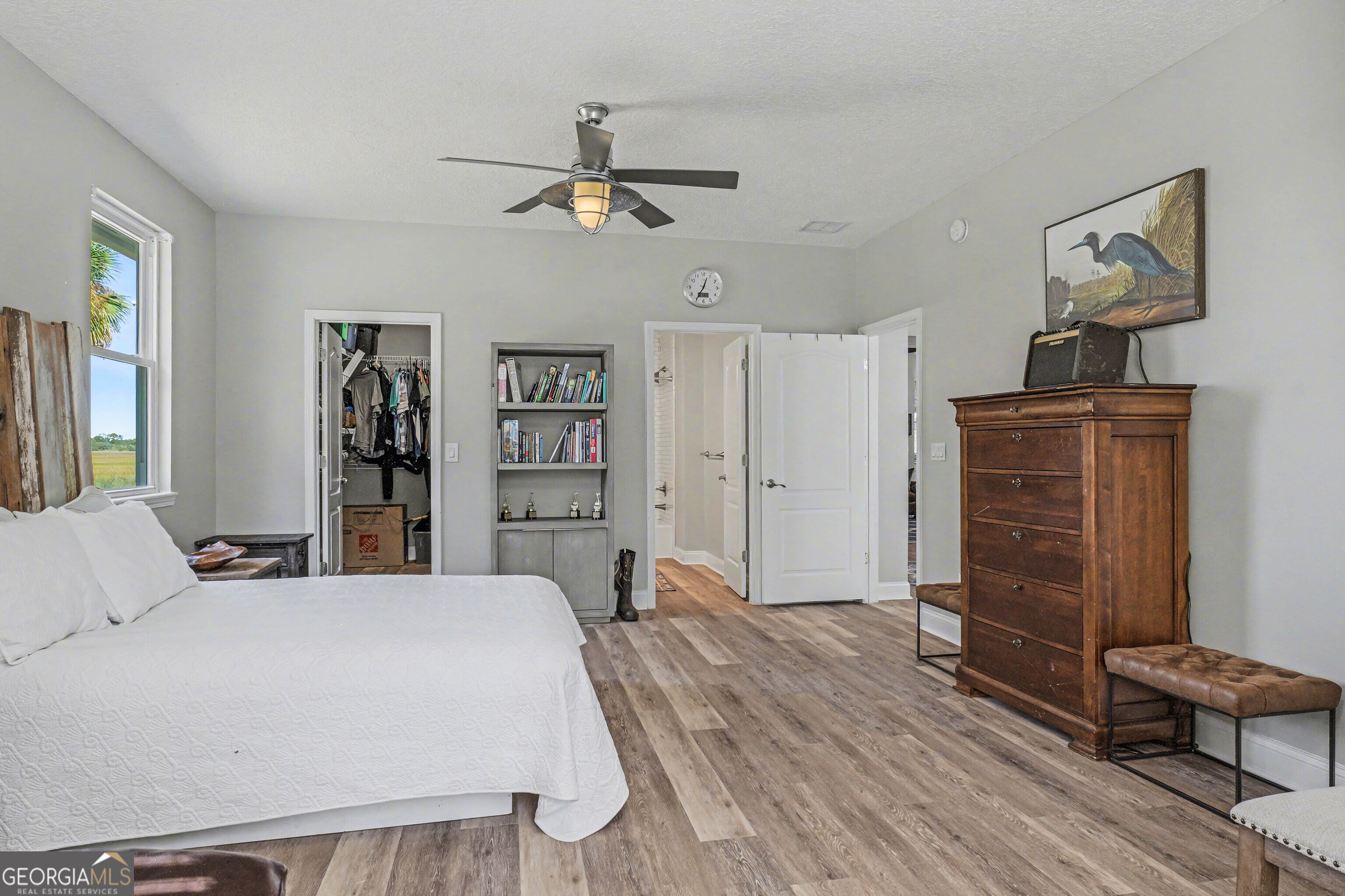 97222 Pirates Point Road Yulee, FL 32097 - Photo 35 of 82 a spacious bedroom with a bed and a dresser