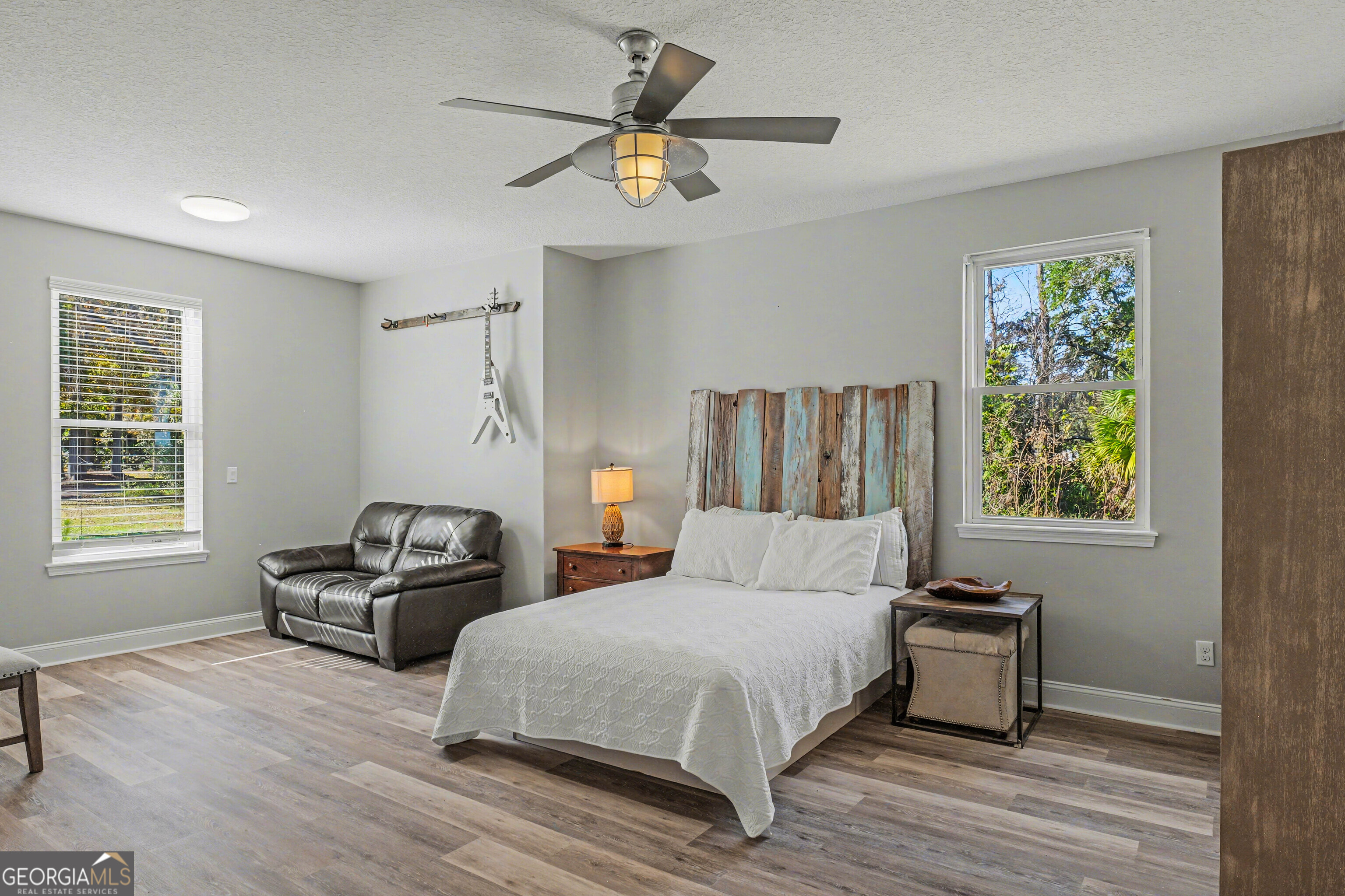 97222 Pirates Point Road Yulee, FL 32097 - Photo 38 of 82 a bedroom with a bed a window and a couch