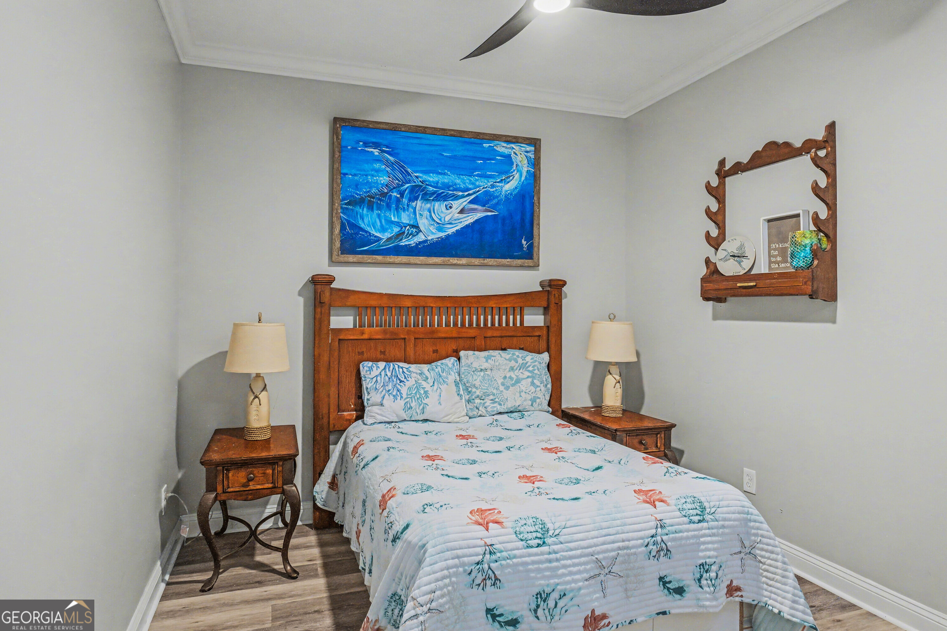 97222 Pirates Point Road Yulee, FL 32097 - Photo 42 of 82 a bedroom with a bed and a painting on the wall