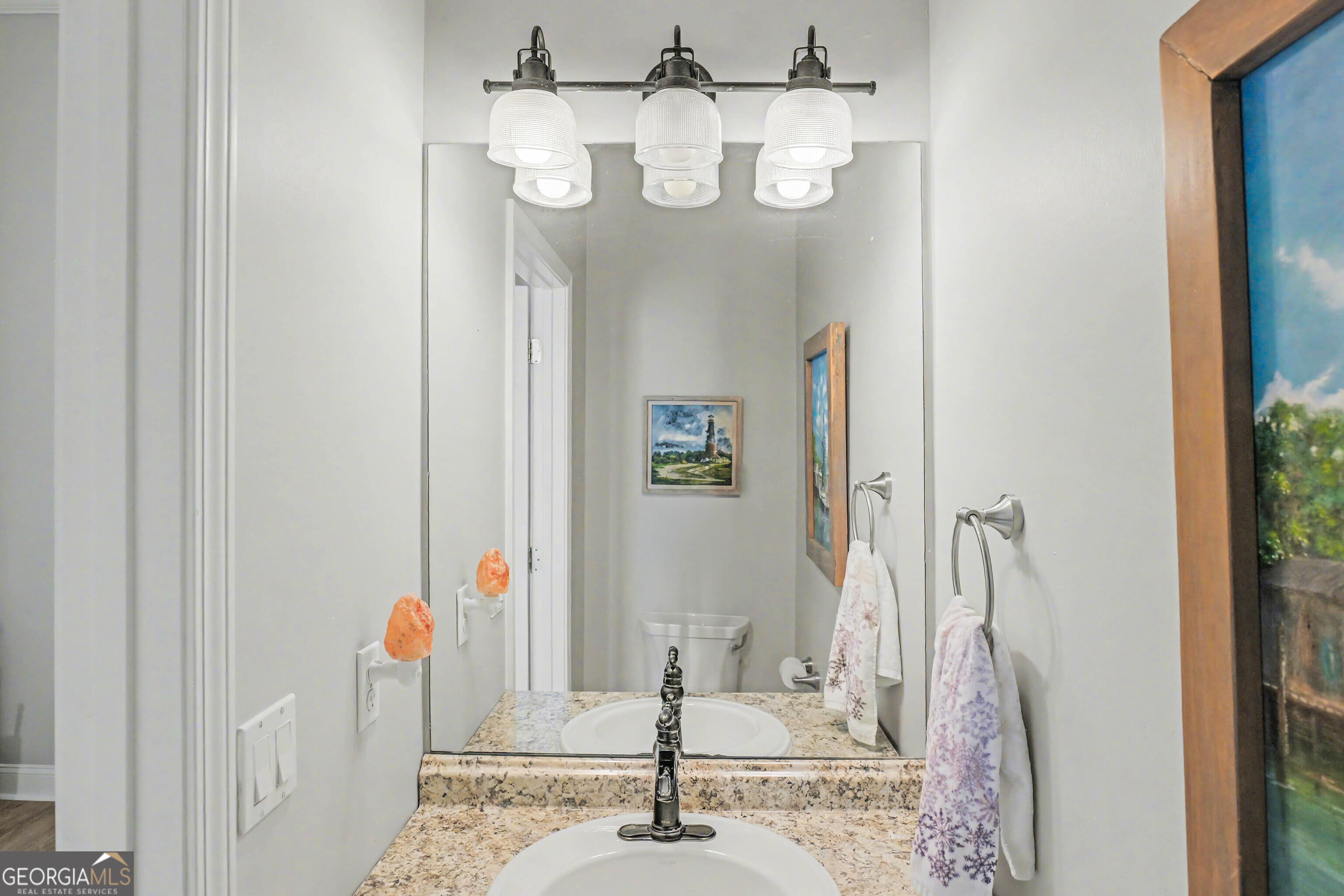 97222 Pirates Point Road Yulee, FL 32097 - Photo 46 of 82 a bathroom with a sink a mirror and shower