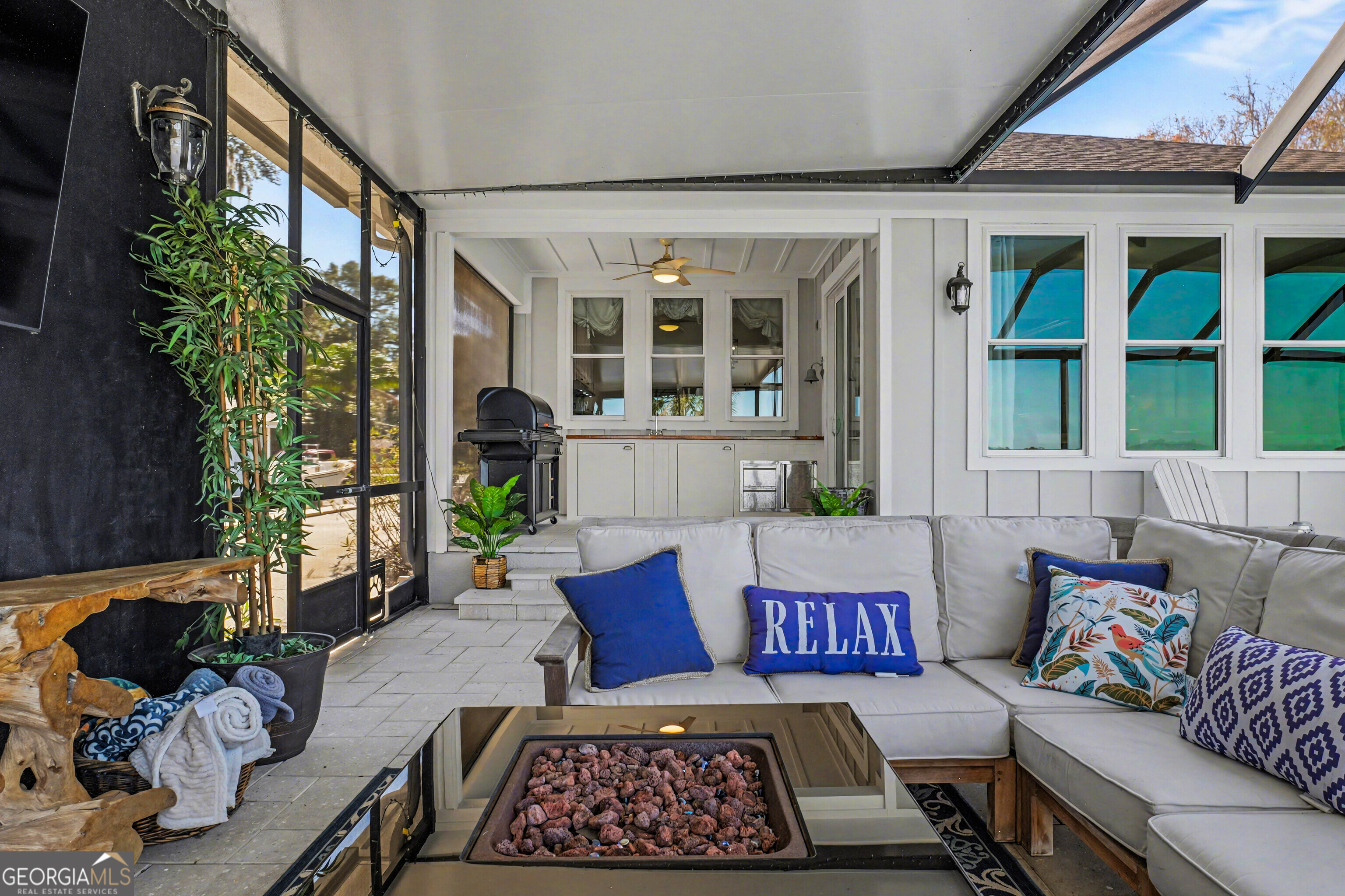 97222 Pirates Point Road Yulee, FL 32097 - Photo 57 of 82 a view of a patio with couches and a potted plant on a table