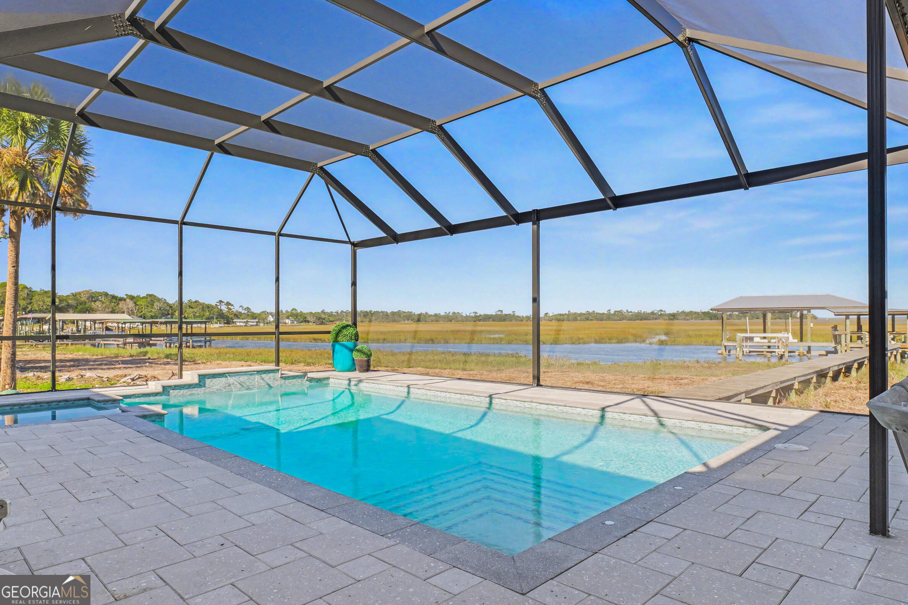 97222 Pirates Point Road Yulee, FL 32097 - Photo 61 of 82 a view of a swimming pool with a lounge chairs