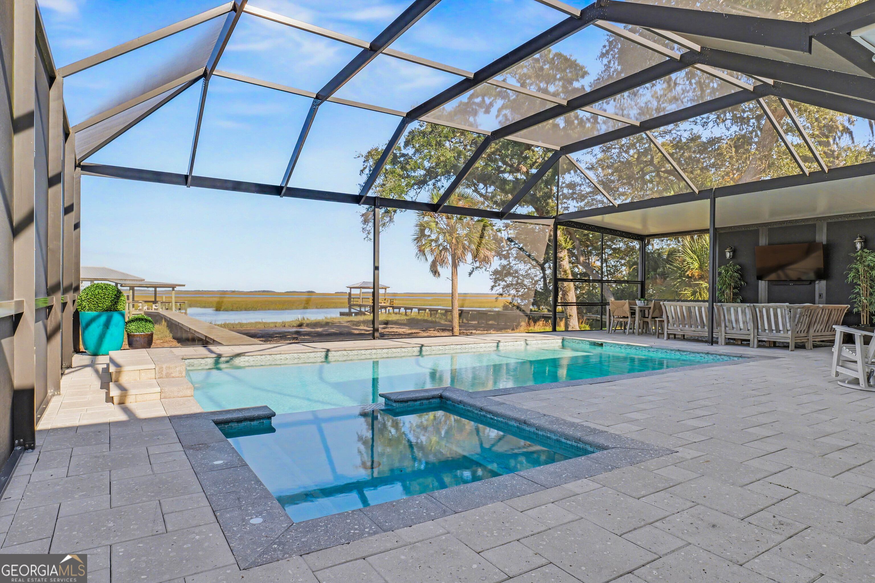 97222 Pirates Point Road Yulee, FL 32097 - Photo 63 of 82 a view of a swimming pool with a patio