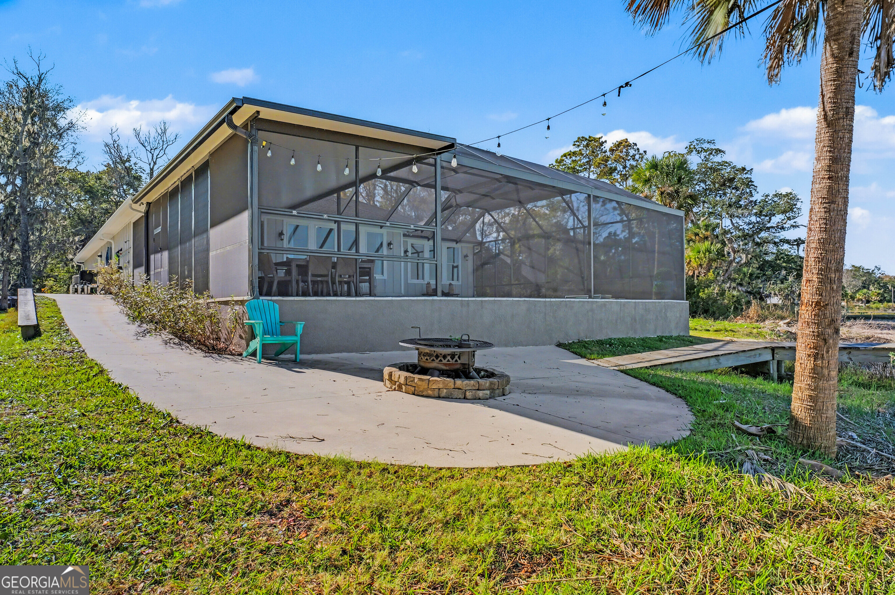 97222 Pirates Point Road Yulee, FL 32097 - Photo 66 of 82 a backyard of a house with lots of green space