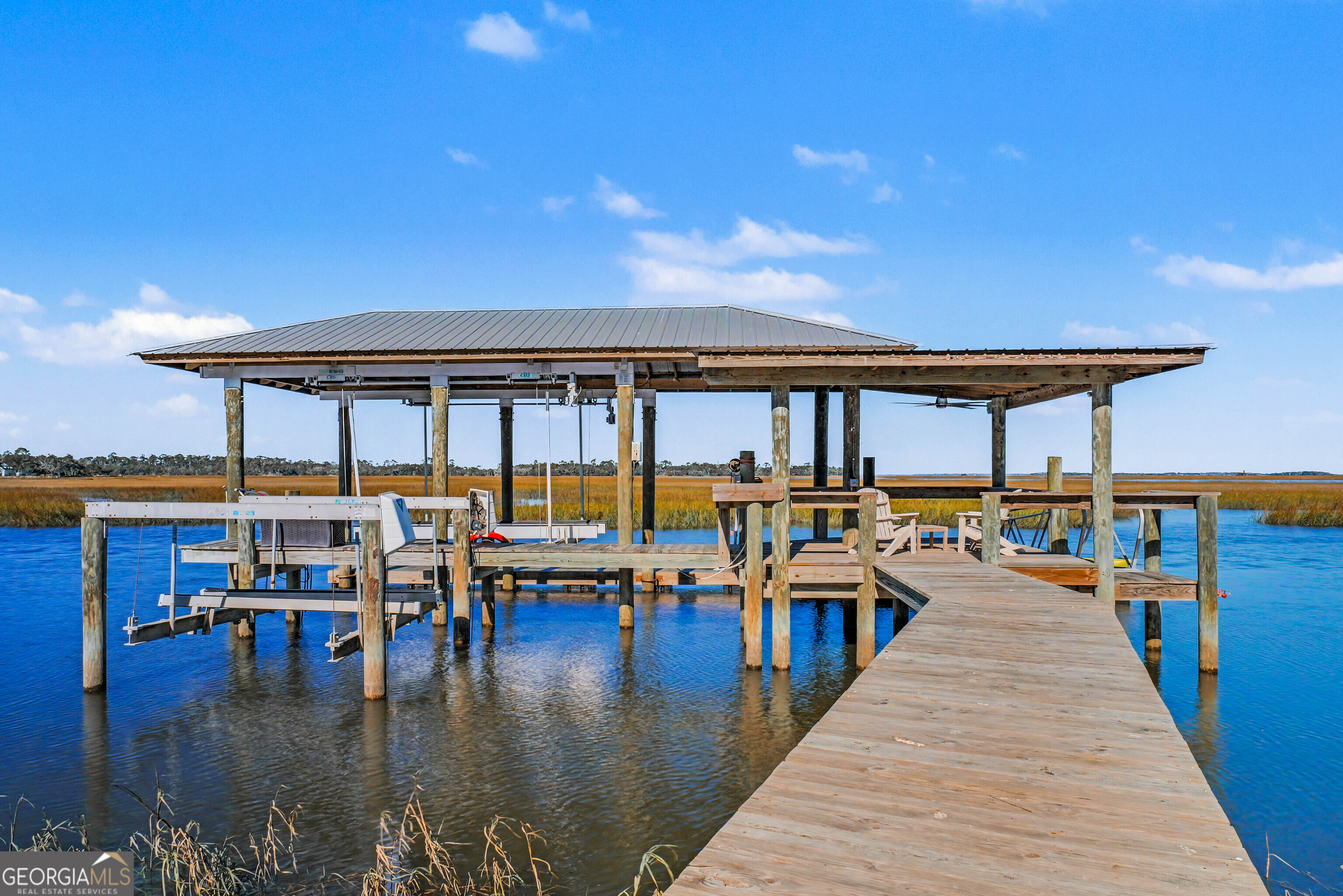 97222 Pirates Point Road Yulee, FL 32097 - Photo 68 of 82 a view of a swimming pool with a deck