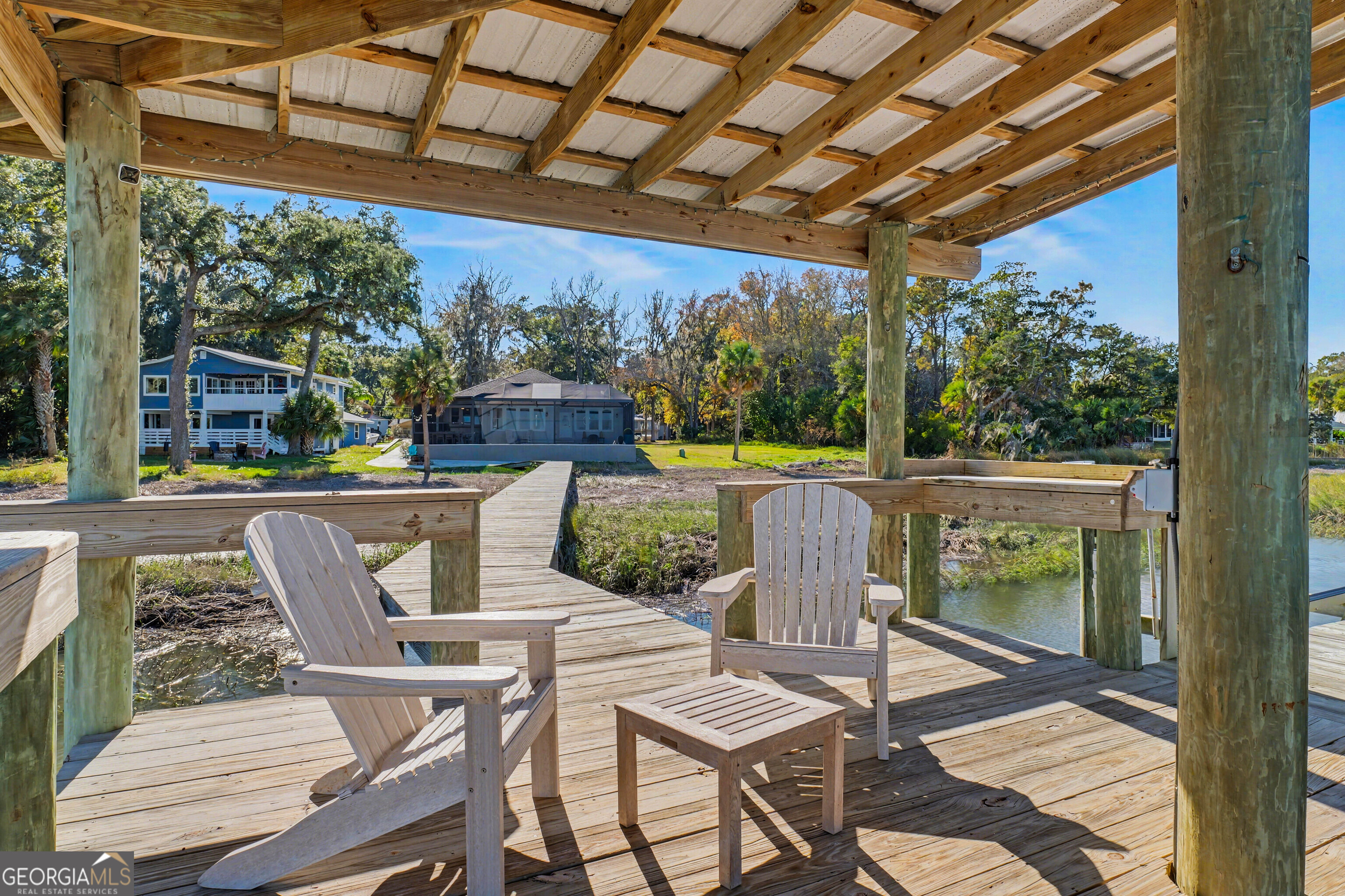 97222 Pirates Point Road Yulee, FL 32097 - Photo 69 of 82 a view of a patio with a table chairs and a patio